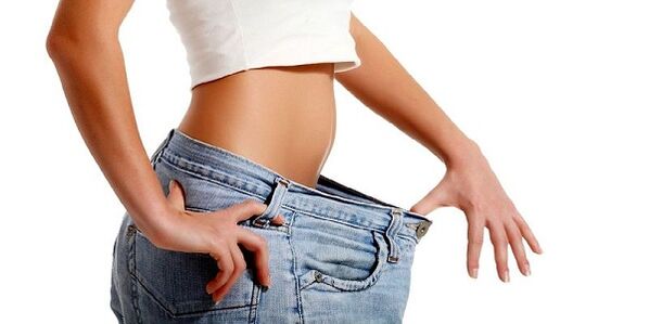The girl lost weight in the abdominal area by removing unhealthy foods from her diet. 